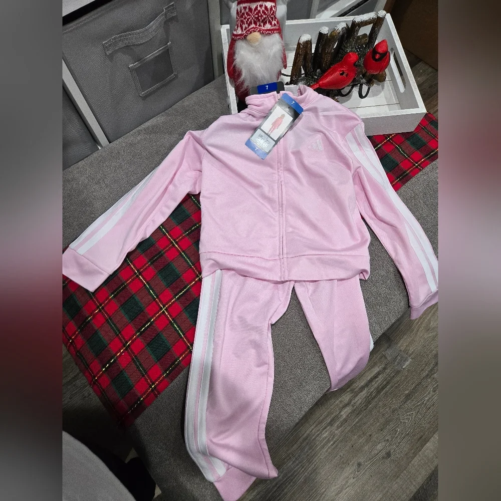 Adidas Toddler Girls 2-pc. Track Suit in light pink‎ with white stripes.
